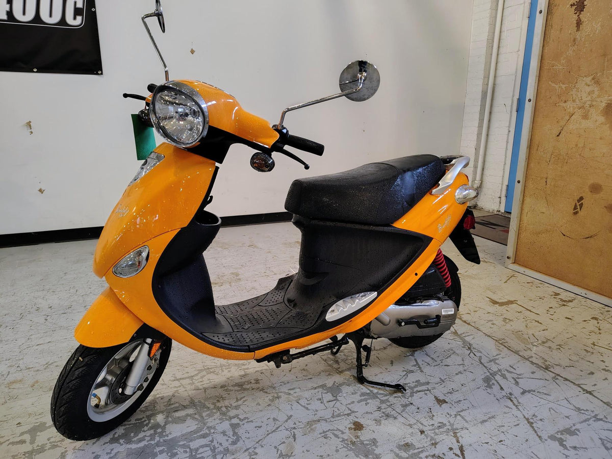 Tangerine 2021 Genuine Buddy 50 scooter, rear side view