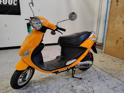 Tangerine 2021 Genuine Buddy 50 scooter, rear side view