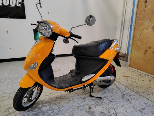 Tangerine 2021 Genuine Buddy 50 scooter, rear side view
