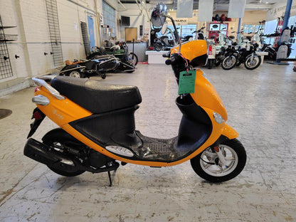 Tangerine 2021 Genuine Buddy 50 scooter, side view